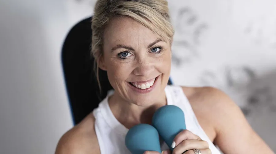 Image of Laura with handheld weights. Laura uses Peristeen Plus.  