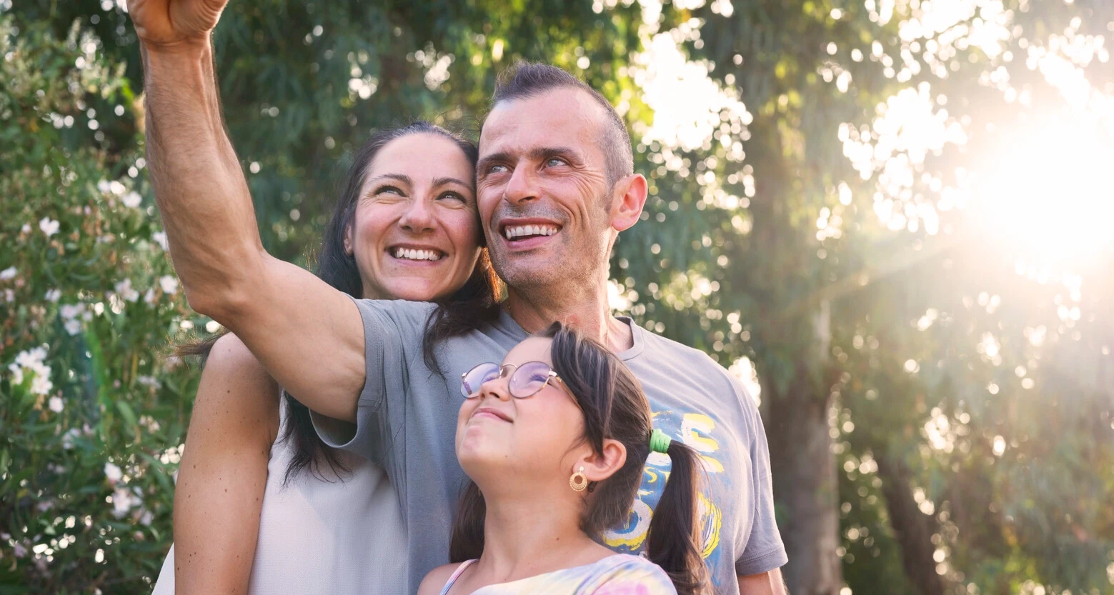 Andrea takes a selfie with his family. Andrea is 45 years old and lives with bladder and bowel issues as a result of his MS.  
