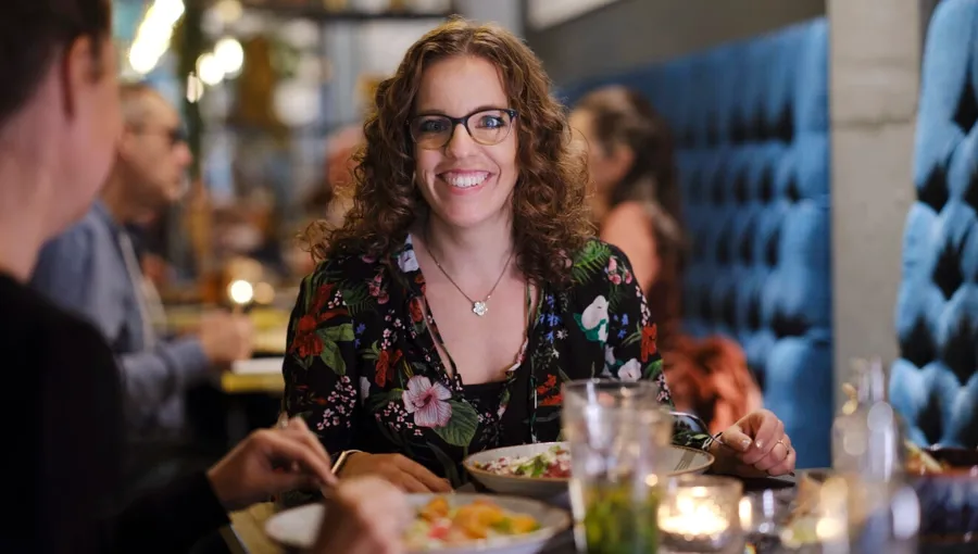 Photo of Marianne dining out with friends. Marianne has a good support network of friends to help her. 